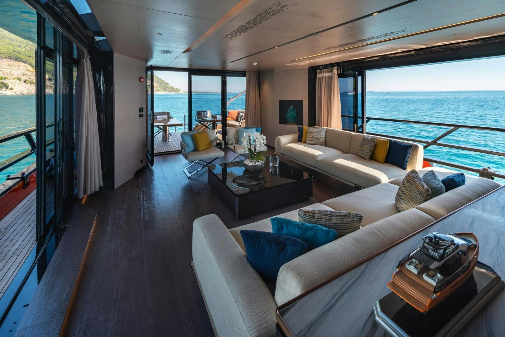 a living room with a large window aboard EDGE   NB 201 Yacht for Sale