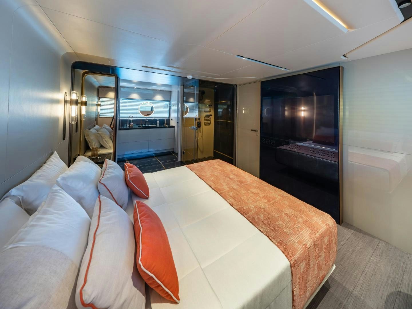 a room with a bed and a large mirror aboard EDGE   NB 201 Yacht for Sale