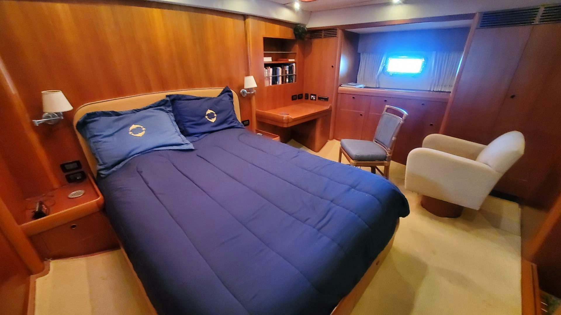 a bed in a room aboard ADJUTOR Yacht for Sale