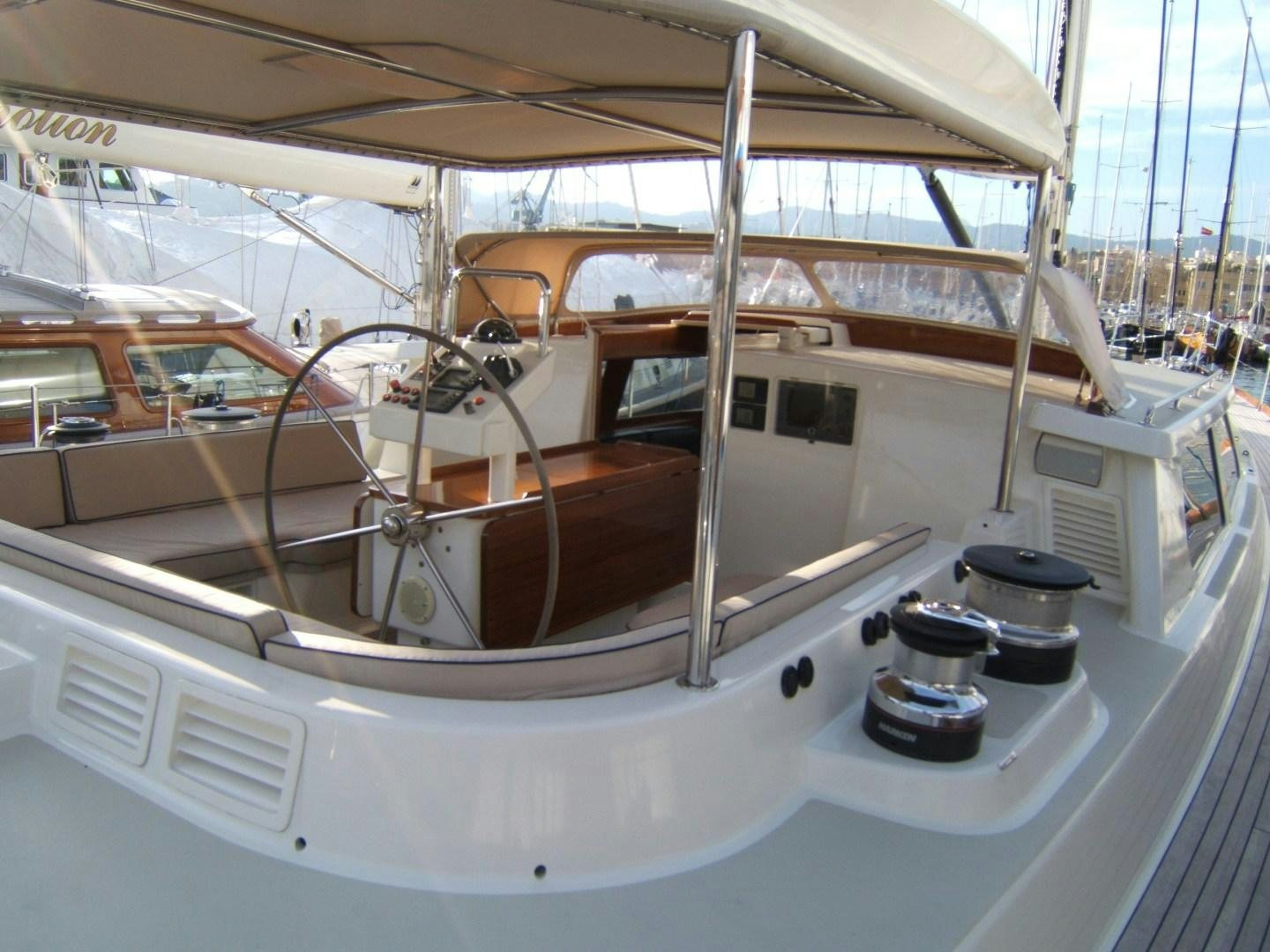 a white boat with a black and orange object on the front aboard ADJUTOR Yacht for Sale