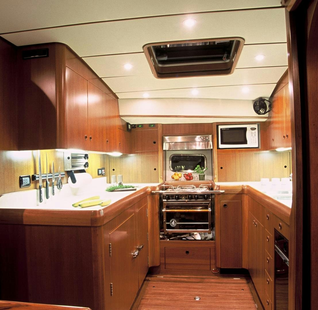 a kitchen with a stove and oven aboard ADJUTOR Yacht for Sale