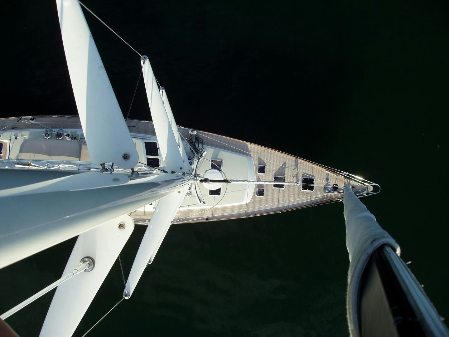a white boat with a white sail aboard ADJUTOR Yacht for Sale