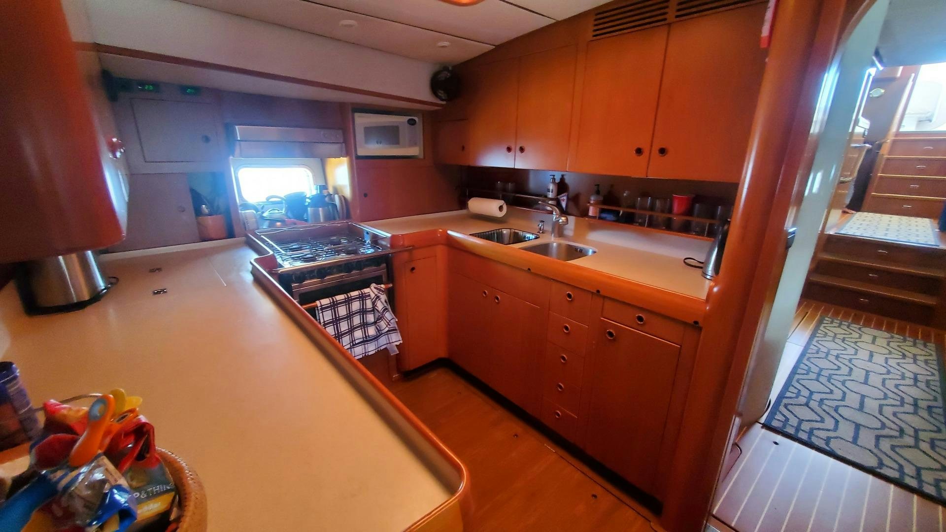 a kitchen with a sink and a stove aboard ADJUTOR Yacht for Sale