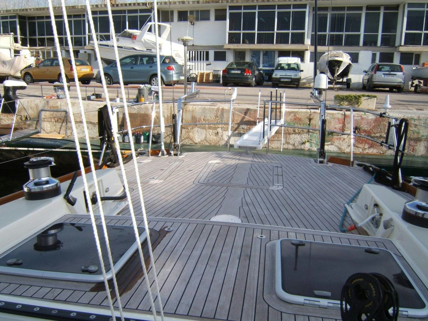 a construction site with cars and a building aboard ADJUTOR Yacht for Sale