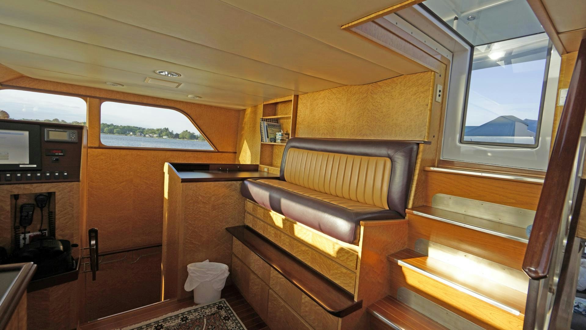 a room with a piano and a window aboard LAID BACK Yacht for Sale