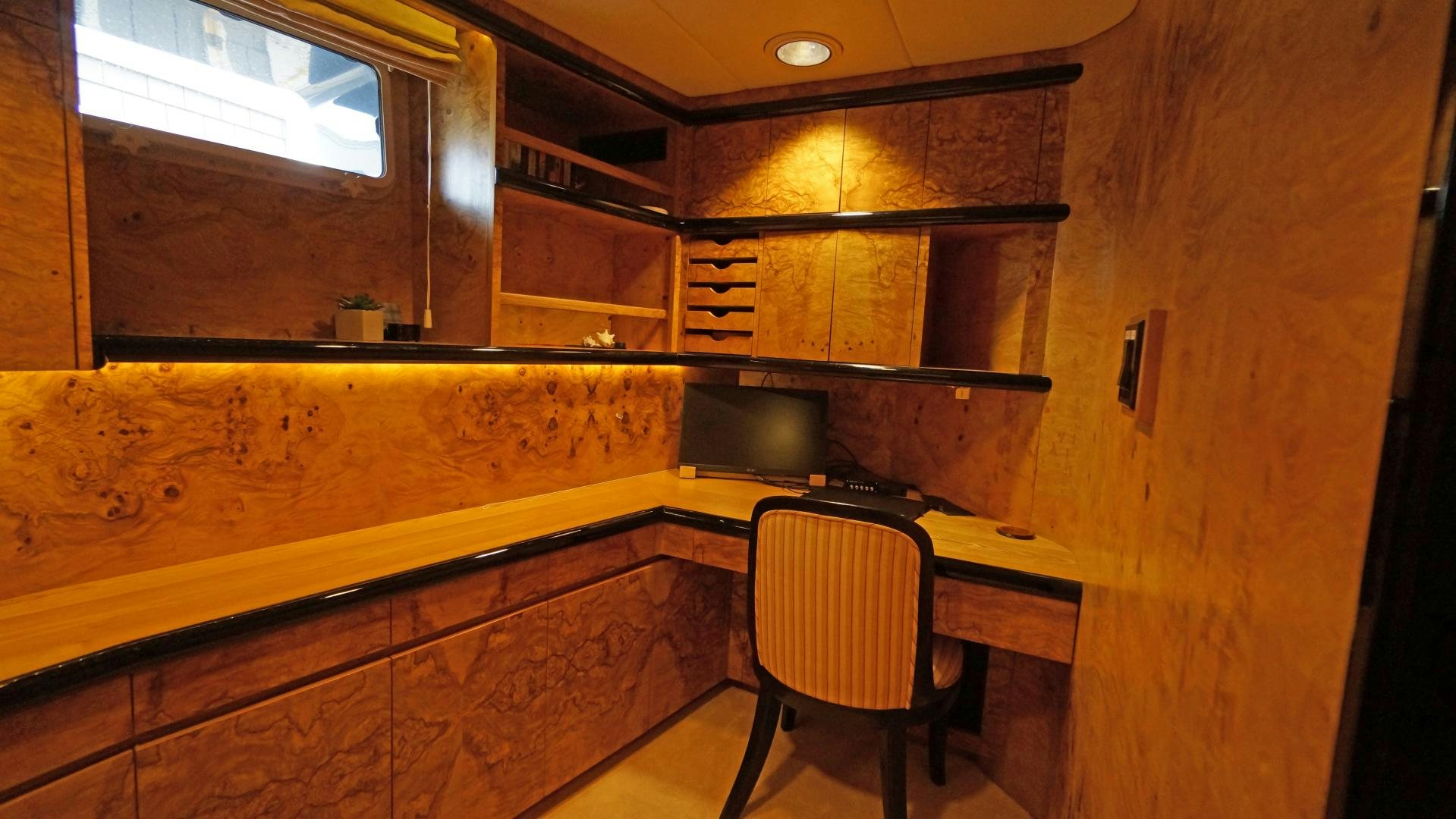 a room with a table and chairs aboard LAID BACK Yacht for Sale
