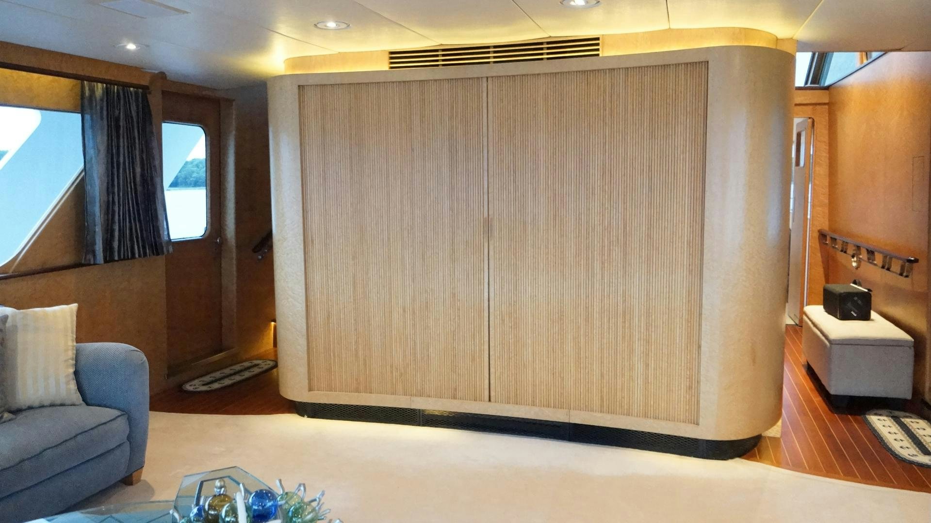 a room with a wood cabinet aboard LAID BACK Yacht for Sale