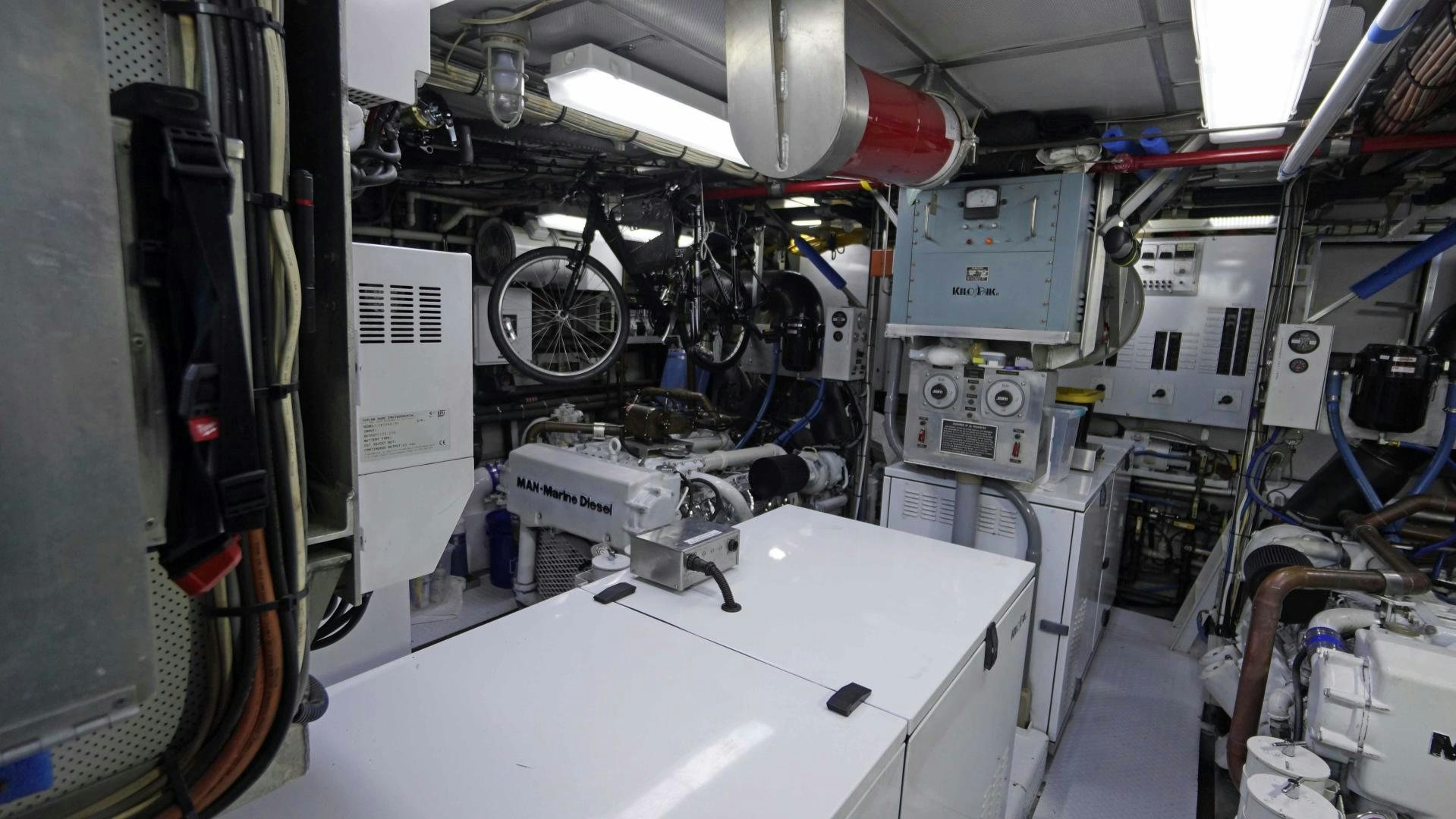 a room with a white table and a white table with a white table and chairs and a white aboard LAID BACK Yacht for Sale