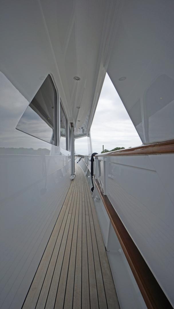 a long hallway with a mirror with Lotus Temple in the background aboard LAID BACK Yacht for Sale