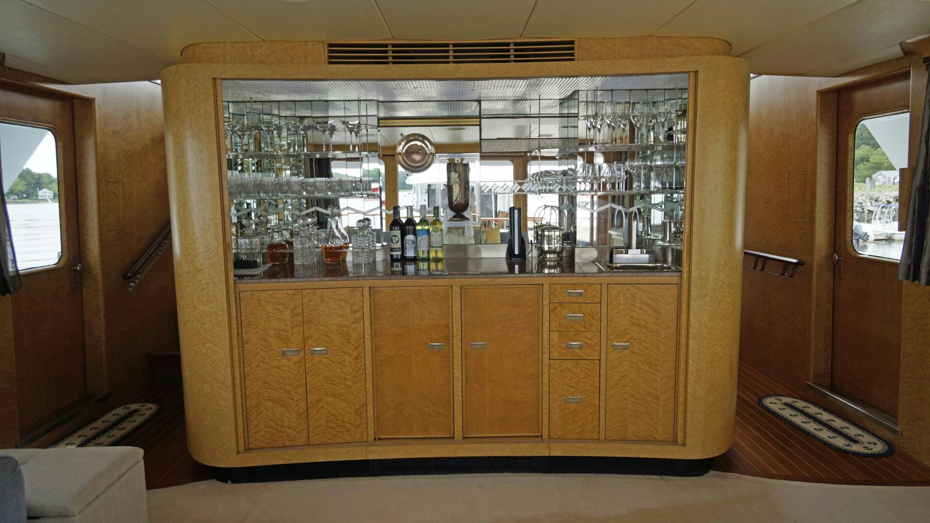 a bar with a bar and glasses aboard LAID BACK Yacht for Sale