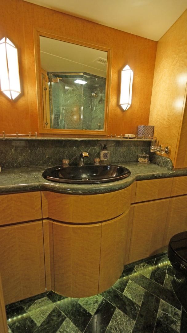 a bathroom with a sink and a mirror aboard LAID BACK Yacht for Sale