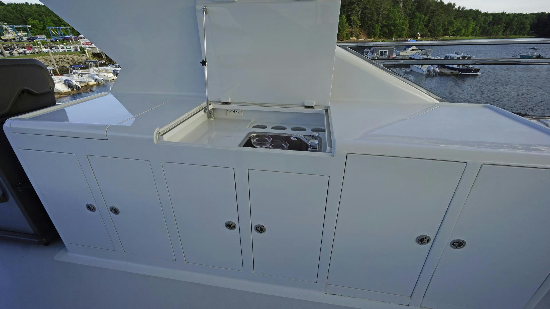 a white machine with a black circle on the top aboard LAID BACK Yacht for Sale