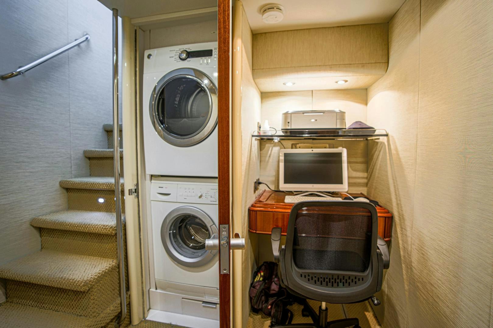 a room with a machine and a chair aboard new horizon Yacht for Sale