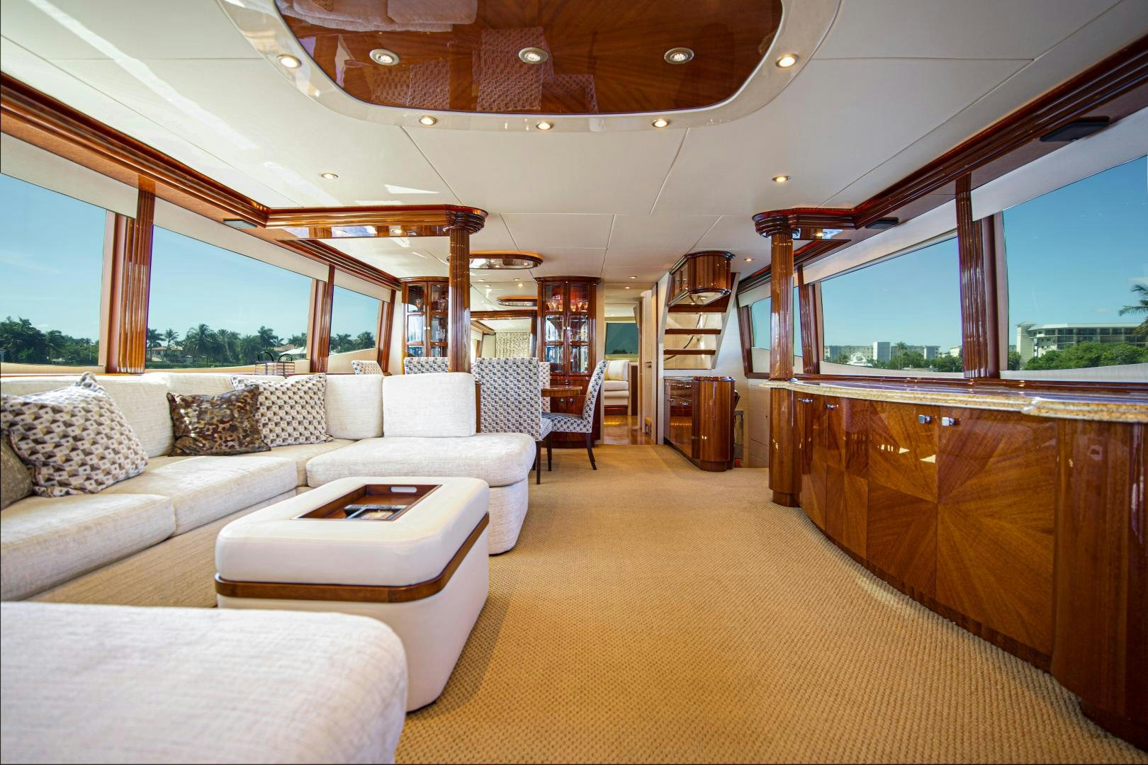 a large living room with a large window aboard new horizon Yacht for Sale
