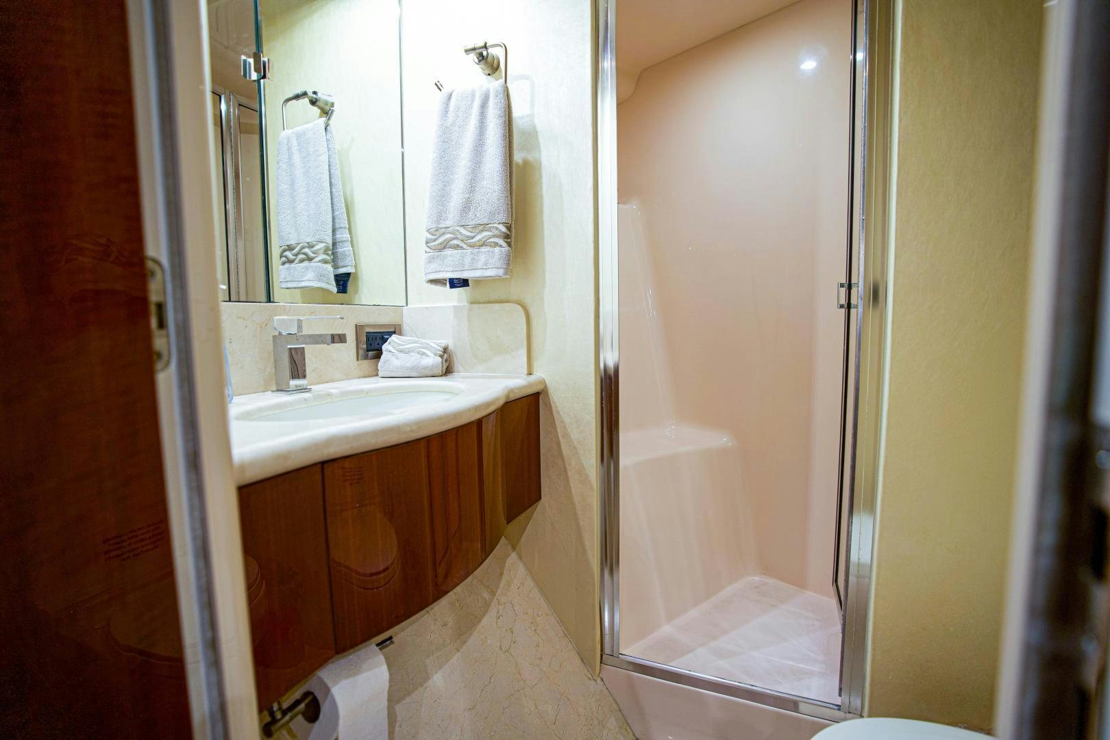 a bathroom with a sink and a shower aboard new horizon Yacht for Sale