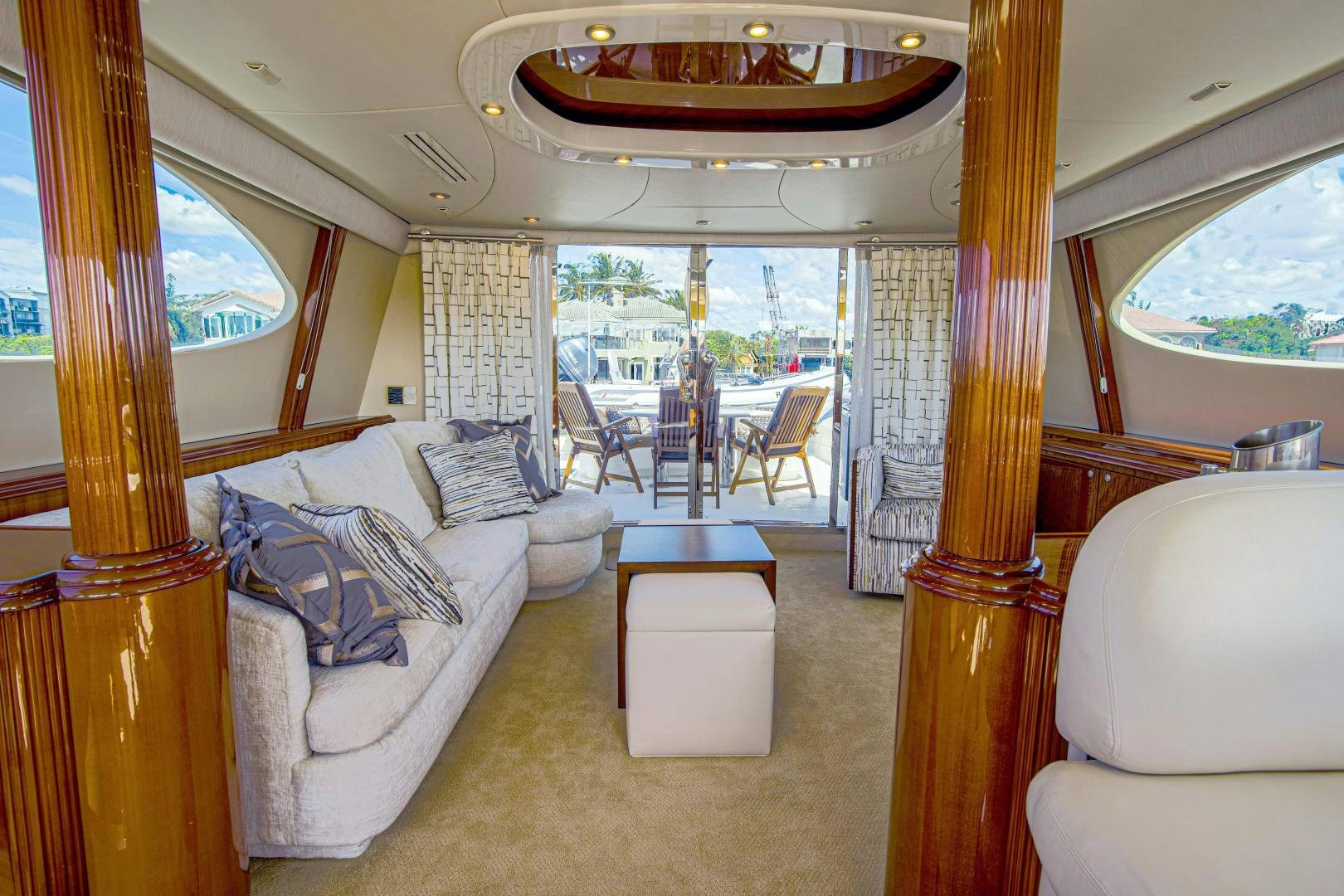 a living room with a large window aboard new horizon Yacht for Sale