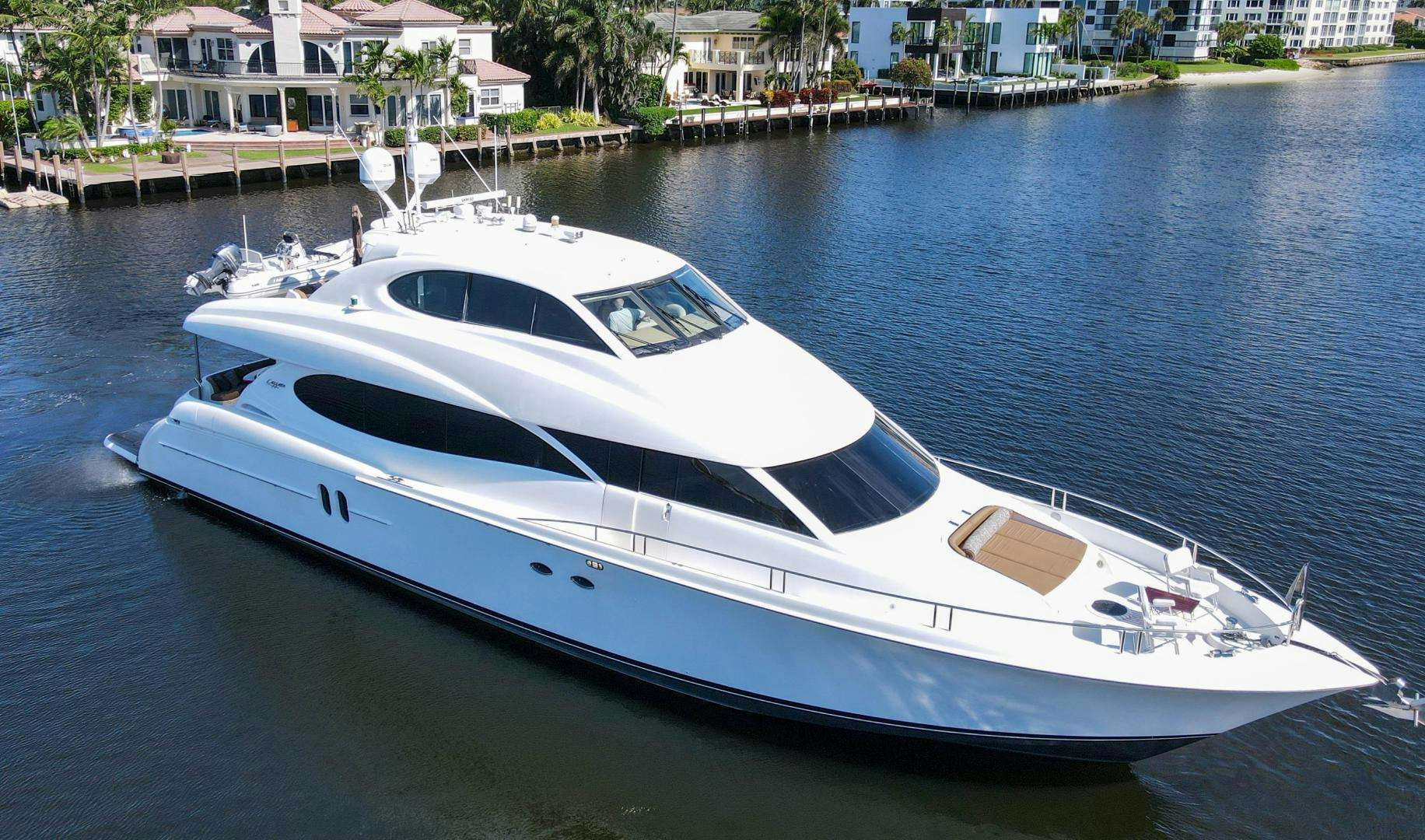a white yacht in a harbor aboard new horizon Yacht for Sale