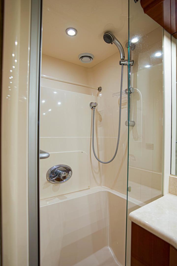 a shower with a glass door aboard new horizon Yacht for Sale
