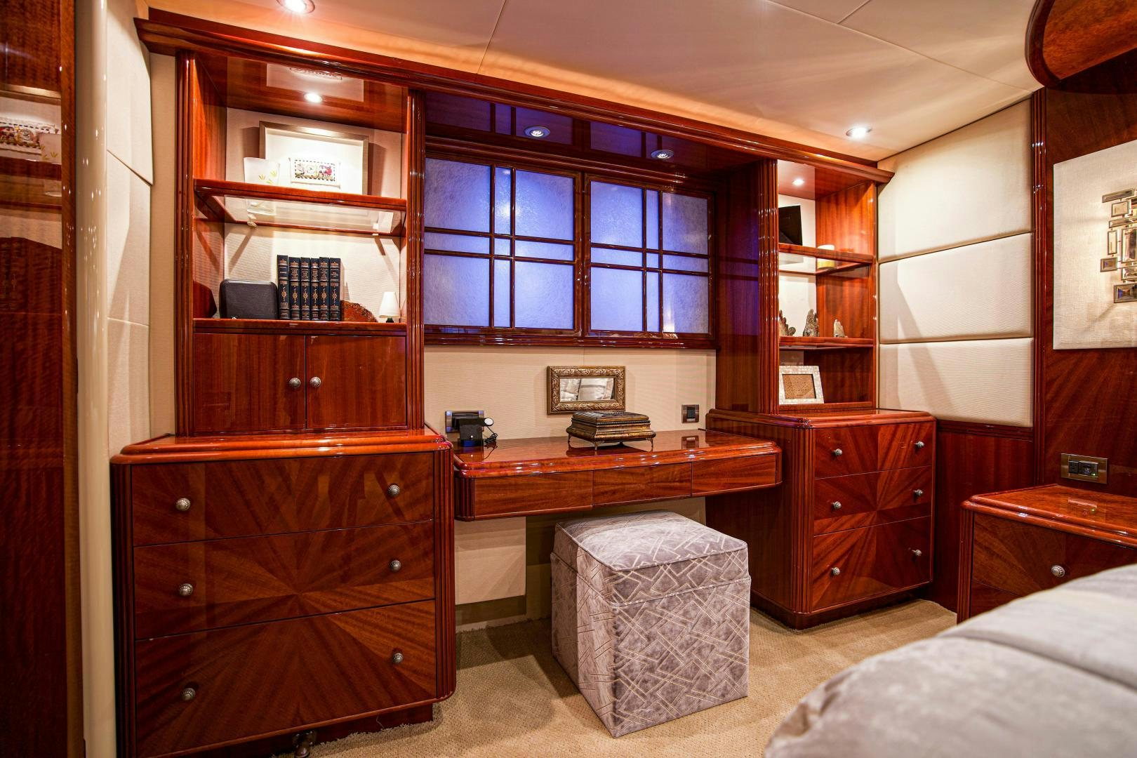 a room with a bed and a desk aboard new horizon Yacht for Sale