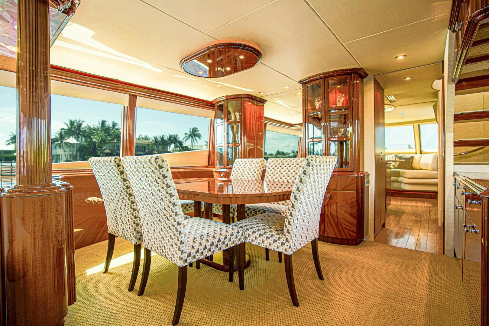a dining room with a table and chairs aboard new horizon Yacht for Sale
