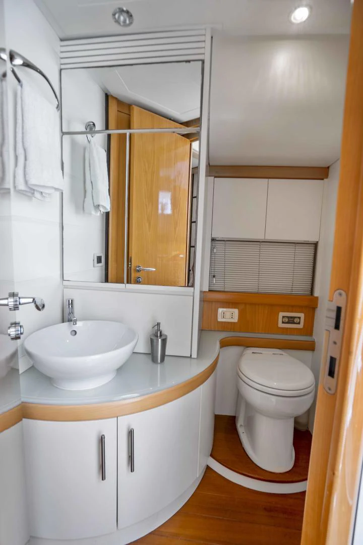 a bathroom with a toilet and sink aboard DENISE Yacht for Sale