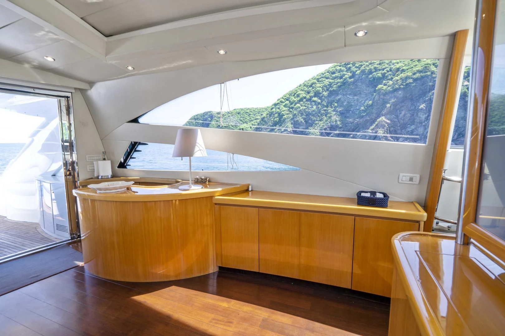 a room with a large window and a view of the ocean aboard DENISE Yacht for Sale