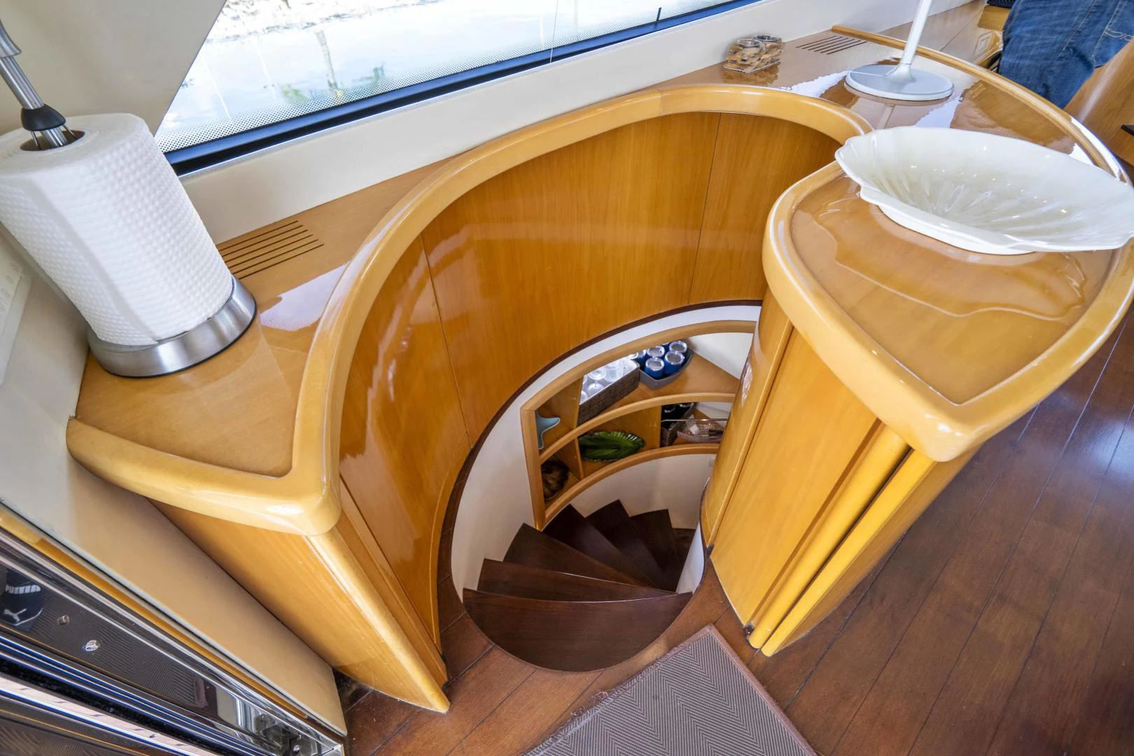 a wooden table with a chair and a window aboard DENISE Yacht for Sale