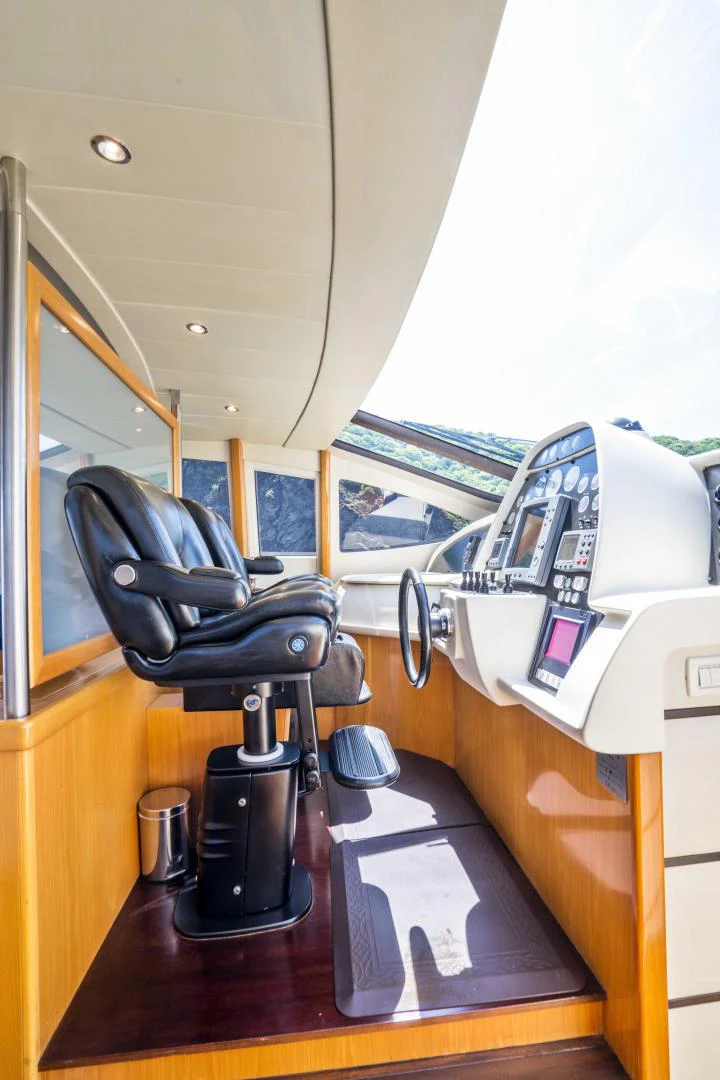 a chair next to a table aboard DENISE Yacht for Sale