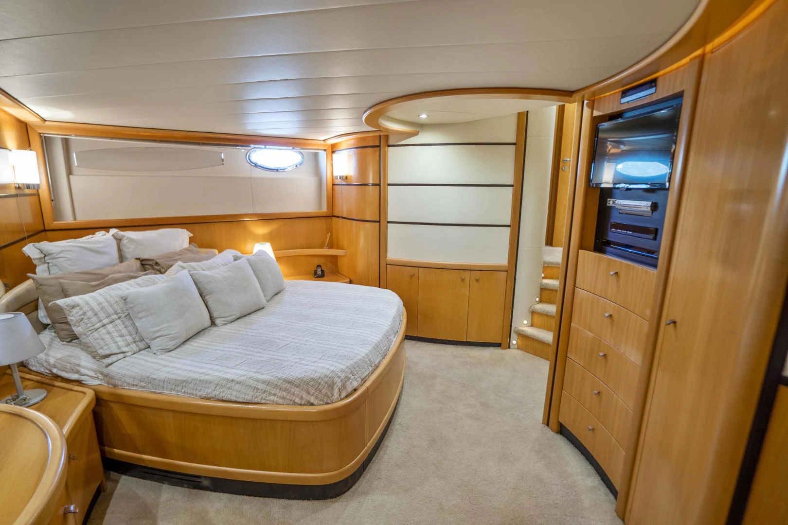 a bedroom with a bed and a closet aboard DENISE Yacht for Sale