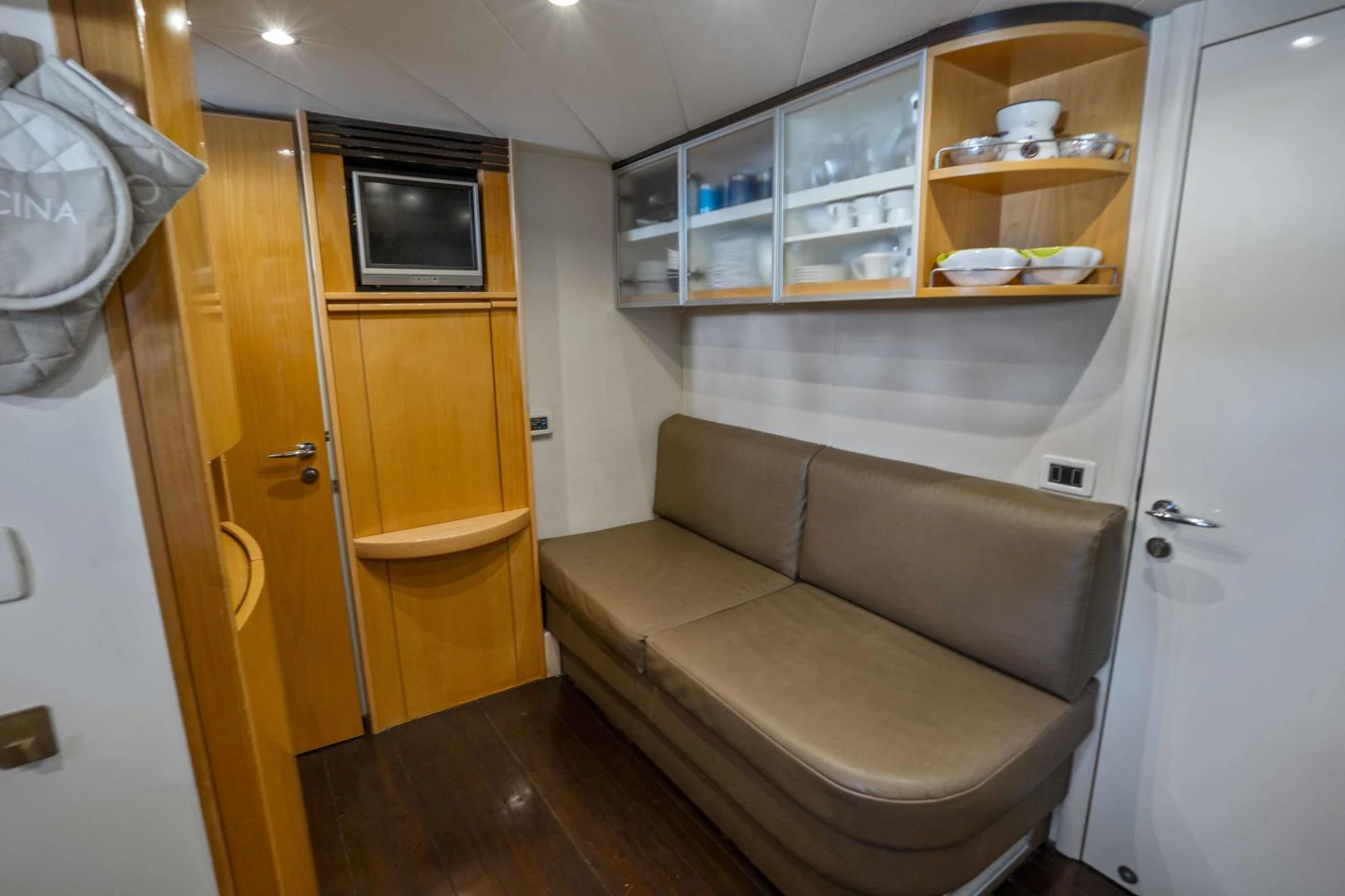 a small living room with a small bed aboard DENISE Yacht for Sale