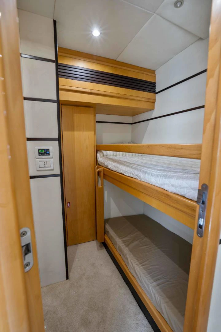 a room with a bed and a closet aboard DENISE Yacht for Sale