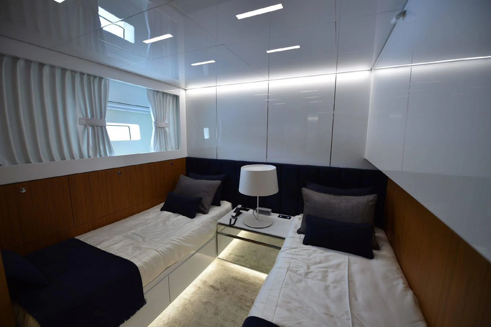 a room with two beds aboard YES Yacht for Sale