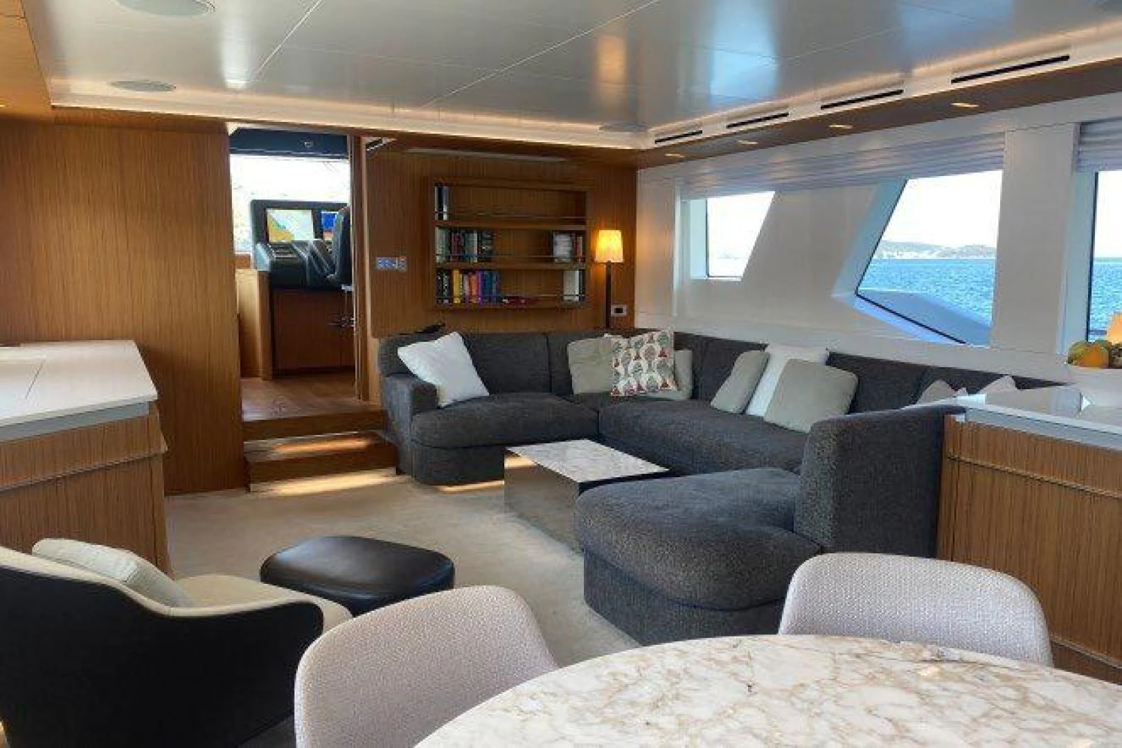 a living room with a couch and a tv aboard YES Yacht for Sale
