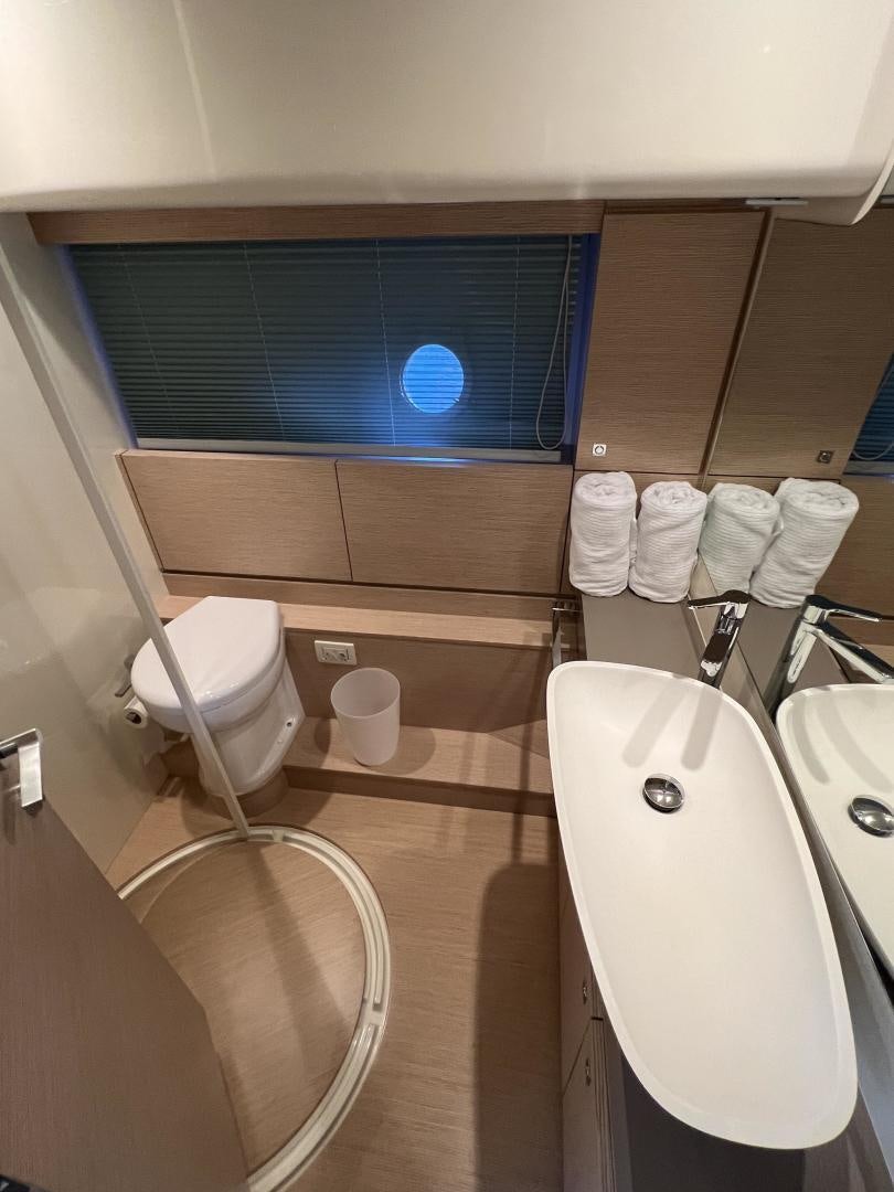 a bathroom with a tub sink and toilet aboard FERRETTI  Yacht for Sale
