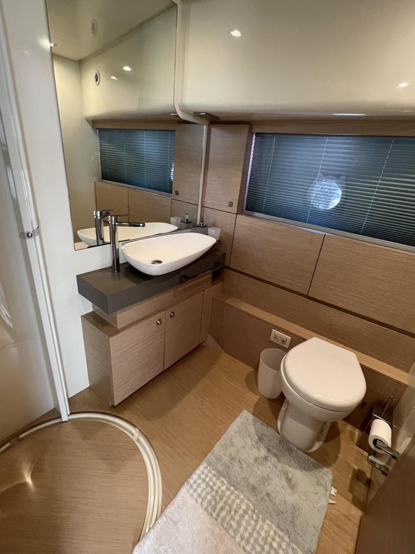 a bathroom with a sink and a toilet aboard FERRETTI  Yacht for Sale
