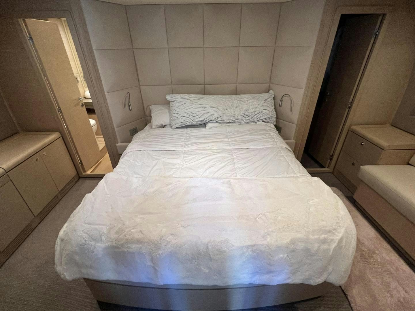 a bed with white sheets aboard FERRETTI  Yacht for Sale