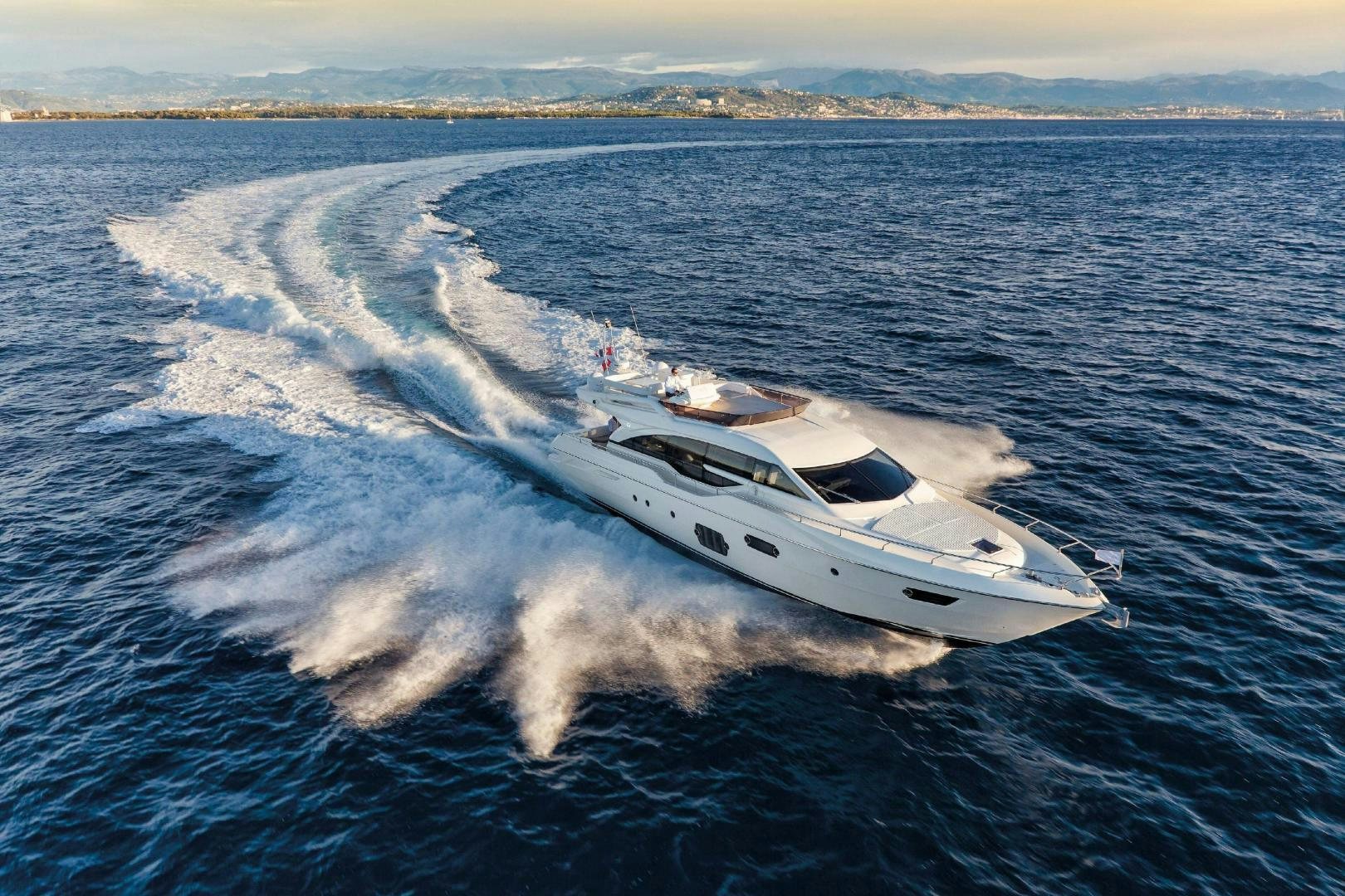 a white yacht on the water aboard FERRETTI  Yacht for Sale