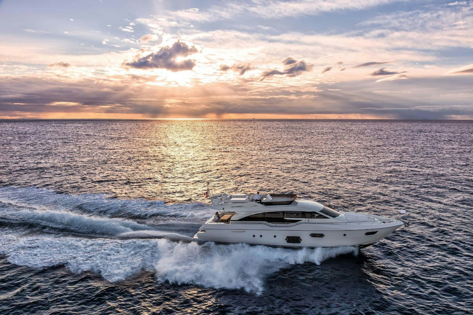 a white yacht in the water aboard FERRETTI  Yacht for Sale