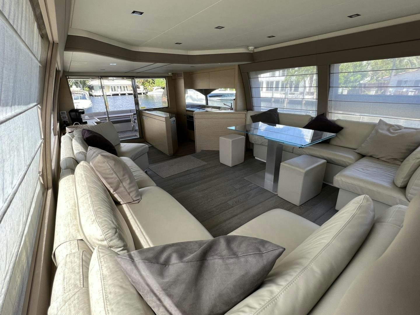 a living room with a large window aboard FERRETTI  Yacht for Sale