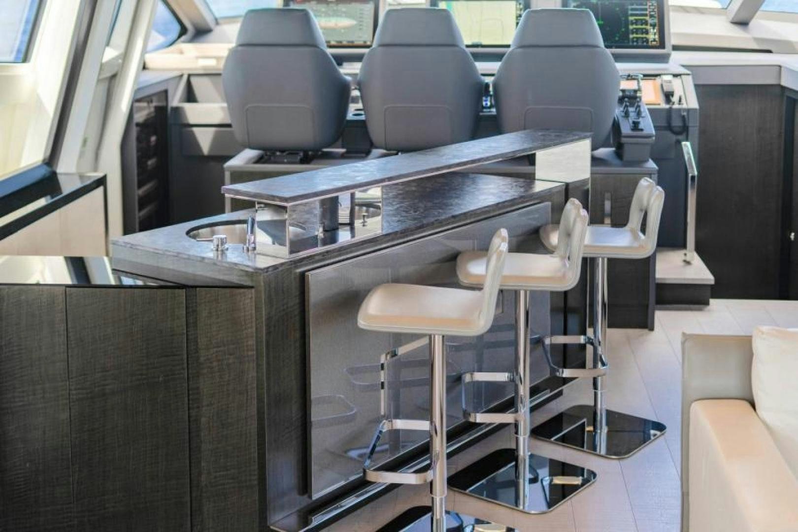 a table with chairs and a desk aboard MARCHELLY Yacht for Sale