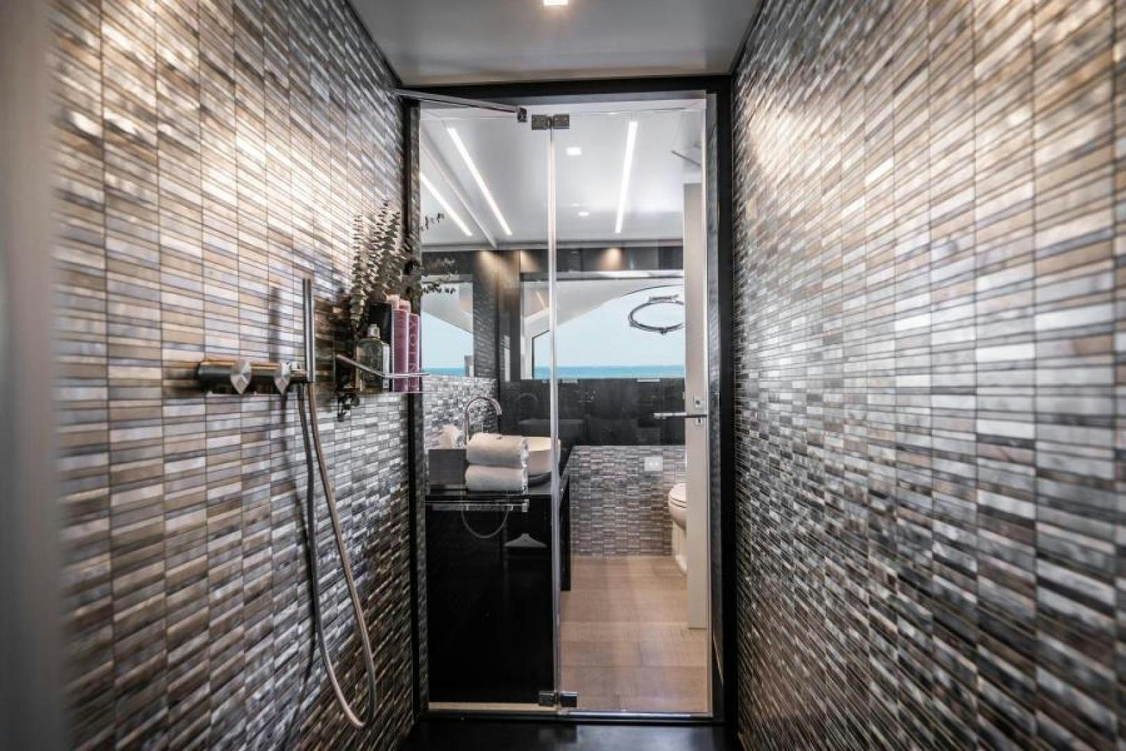 a hallway with a glass door aboard MARCHELLY Yacht for Sale