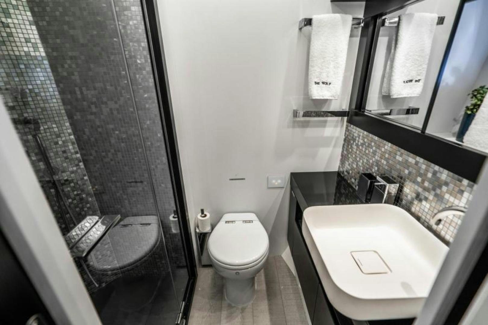 a bathroom with a glass shower aboard MARCHELLY Yacht for Sale