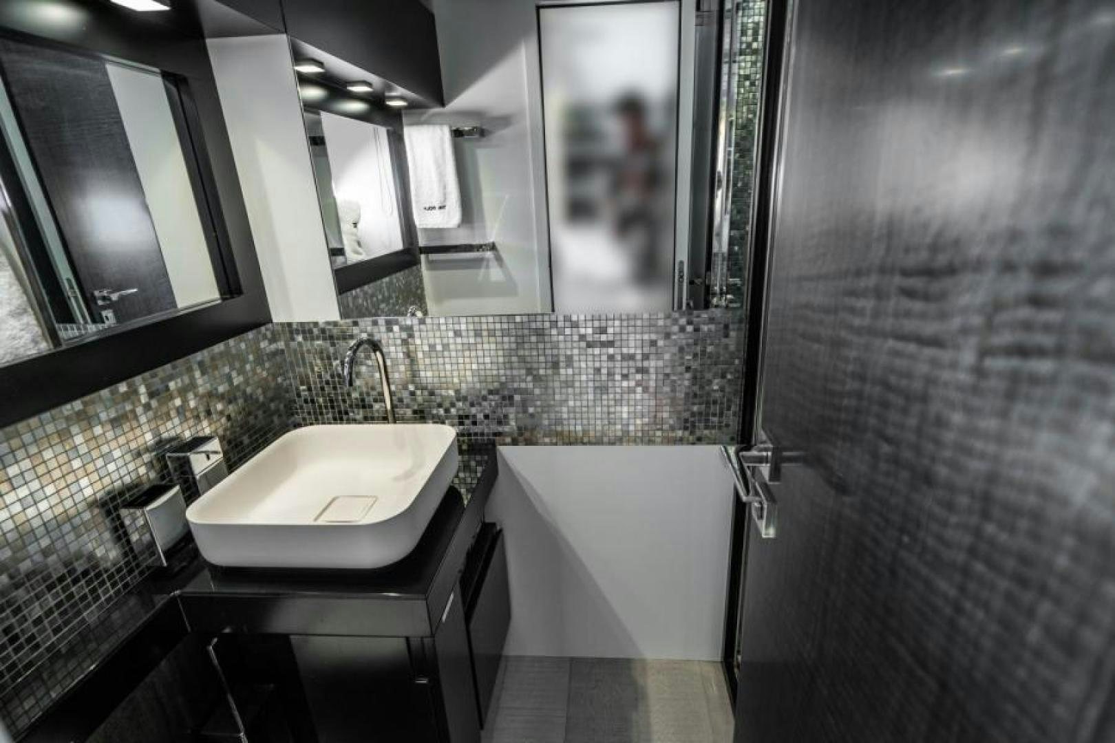 a bathroom with a sink and a bathtub aboard MARCHELLY Yacht for Sale