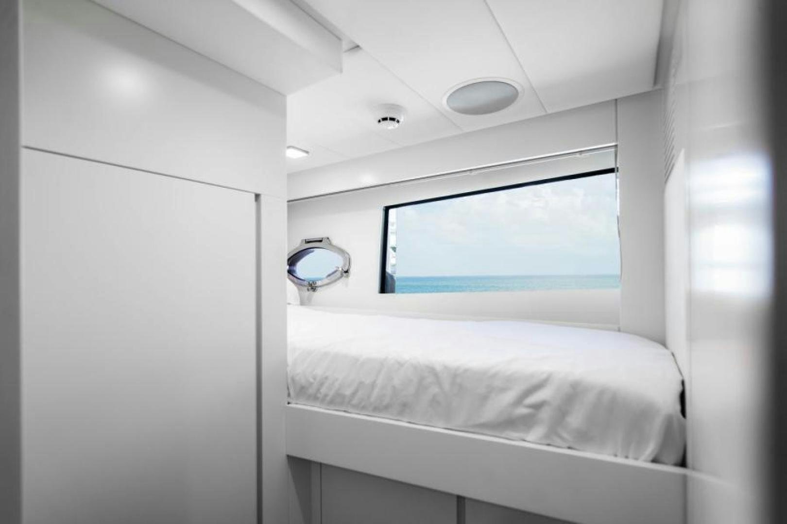 a white room with a mirror and a bed aboard MARCHELLY Yacht for Sale