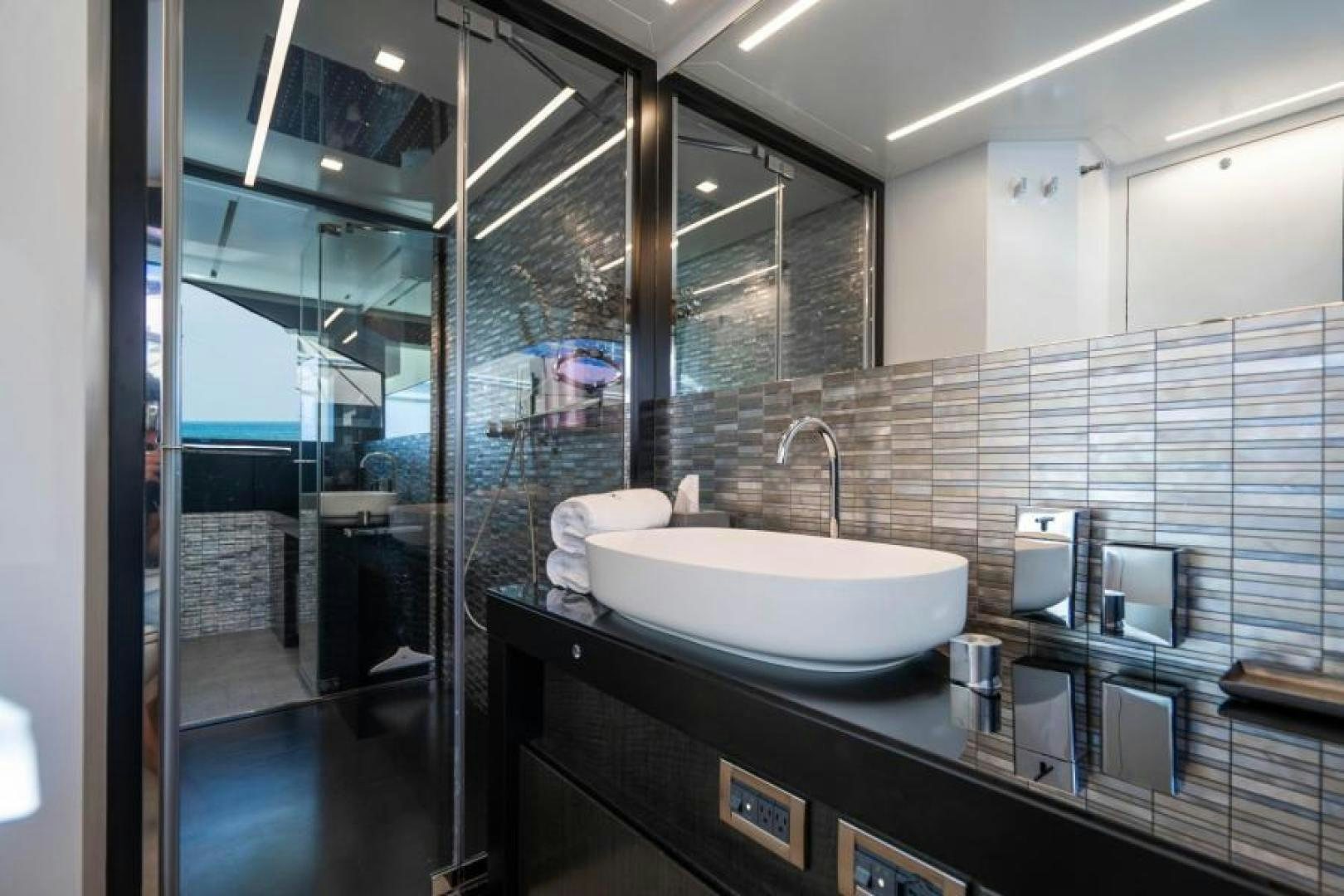 a bathroom with a sink and a mirror aboard MARCHELLY Yacht for Sale