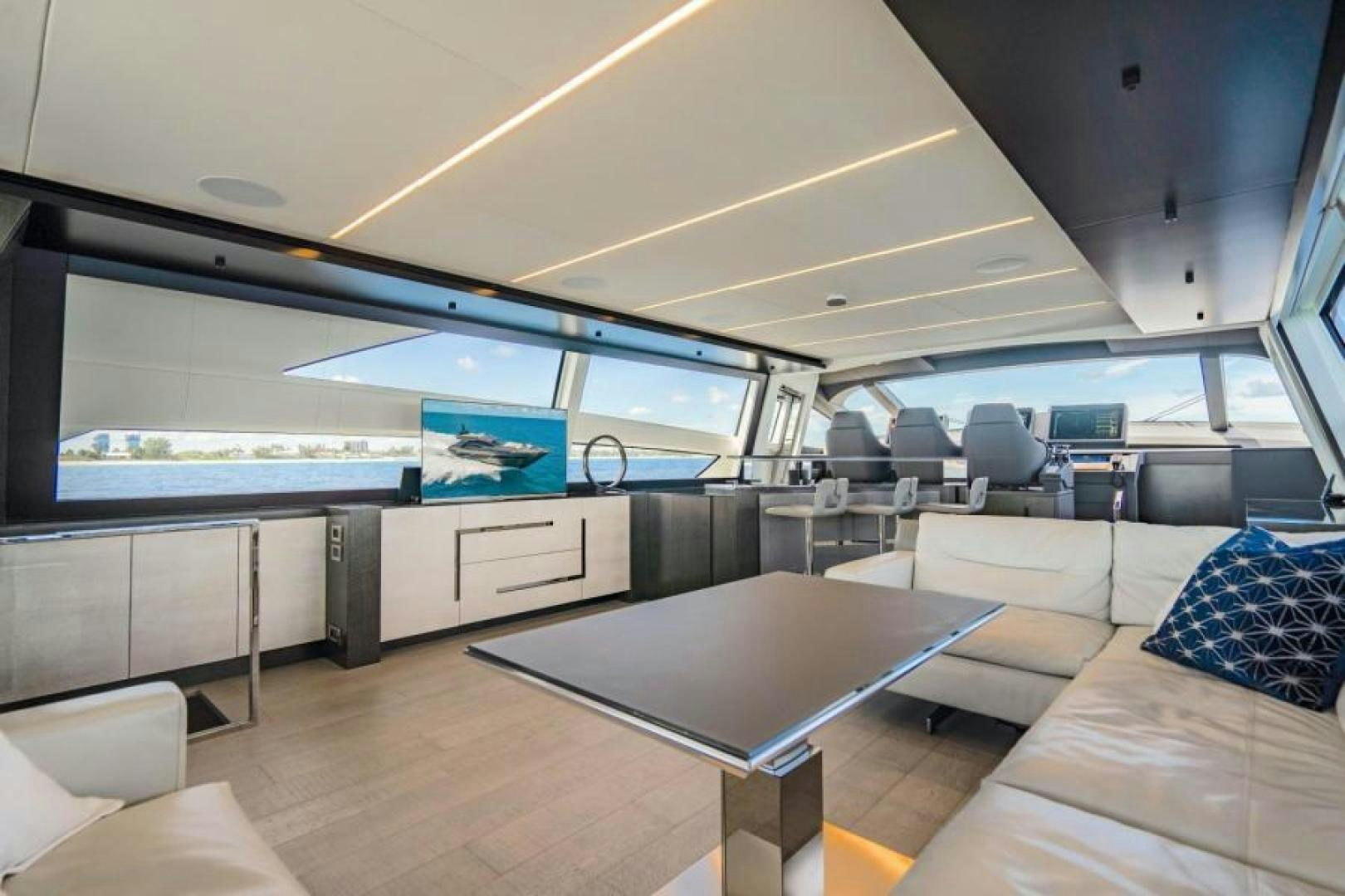 a room with a table and couches aboard MARCHELLY Yacht for Sale