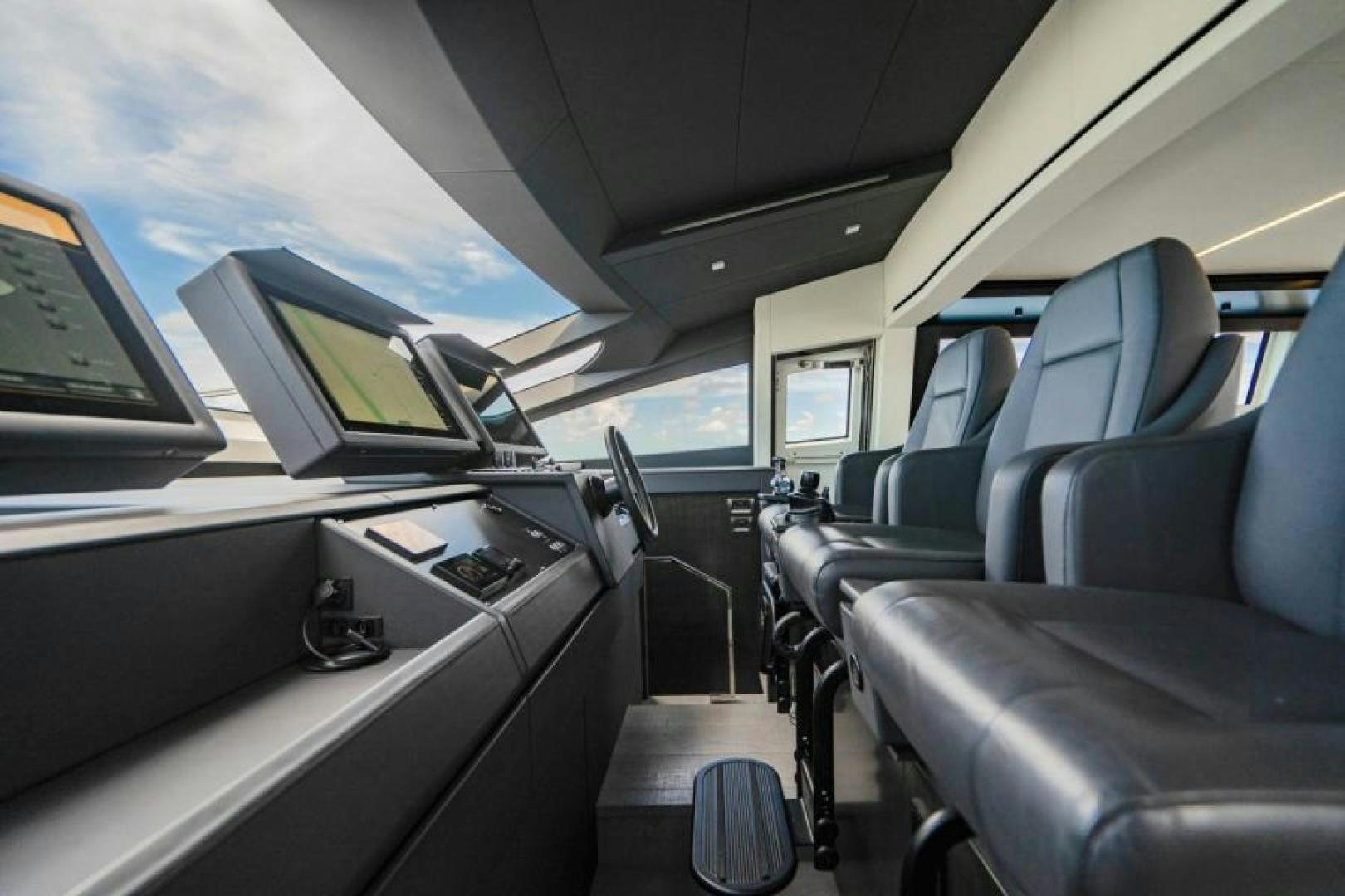 inside of a vehicle with seats and a computer monitor and a keyboard aboard MARCHELLY Yacht for Sale