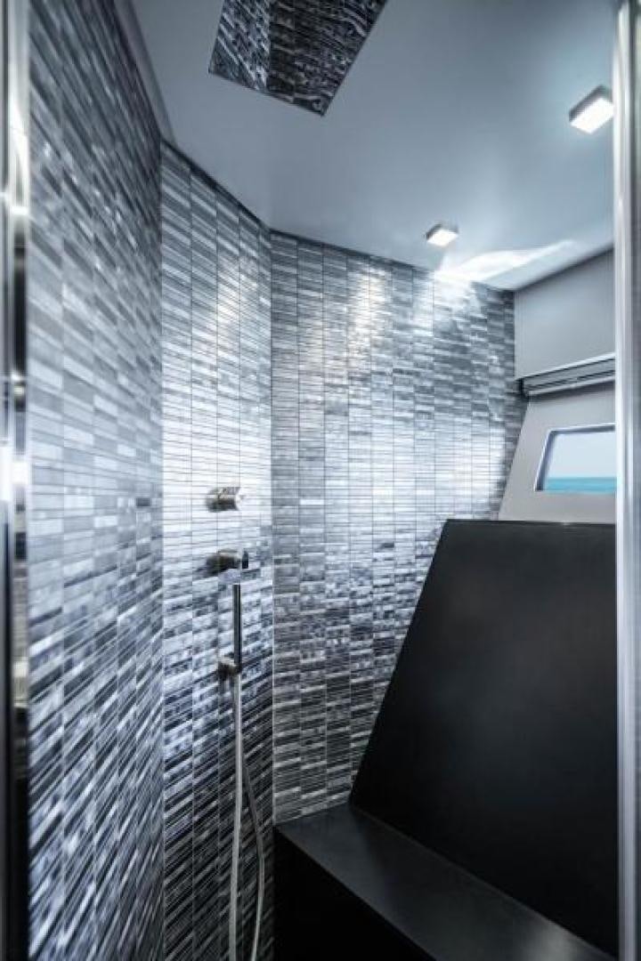 a room with a television and a window aboard MARCHELLY Yacht for Sale