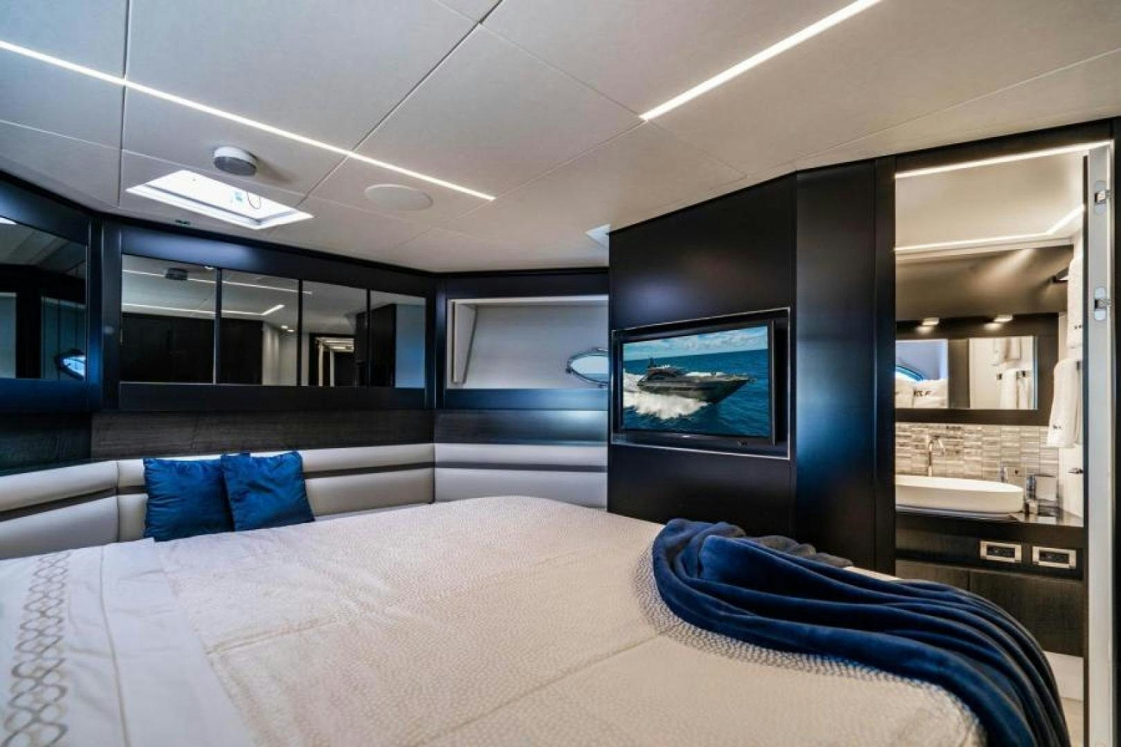 a room with a bed and a tv on the wall aboard MARCHELLY Yacht for Sale