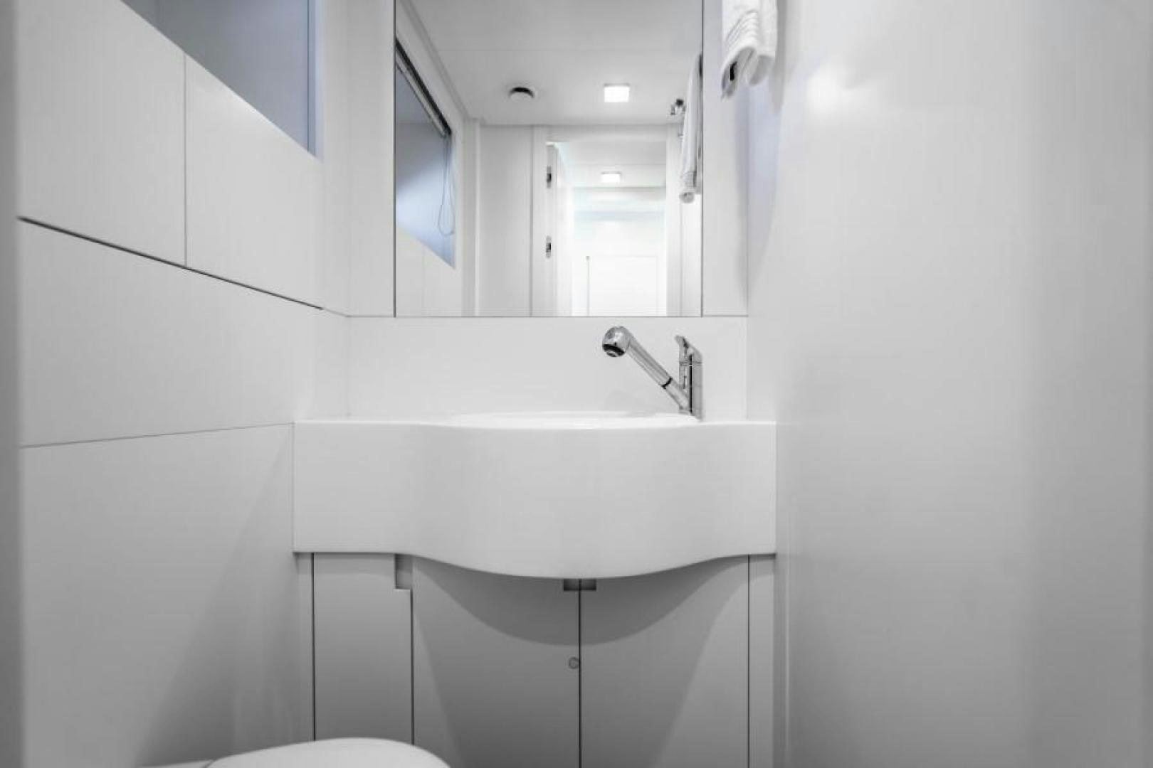 a bathroom with a sink and a mirror aboard MARCHELLY Yacht for Sale